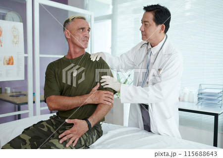 Soldier Complaining On His Arm Soldier Complaining On His Arm 115688643