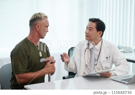 Doctor Giving Recommendations To Soldier Doctor Giving Recommendations To Soldier 115688730