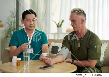 Soldier Checking His Blood Pressure Soldier Checking His Blood Pressure 115688767