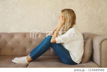 Upset sad crying woman while experiencing mental suffering, depression, fatigue, emotional stress 115689560
