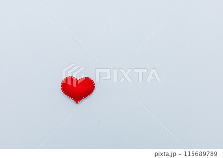 Felt red heart isolated on a white background Felt red heart isolated on a white background 115689789