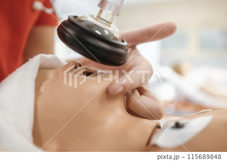 Training resuscitation training on newborn dummy. 115689848