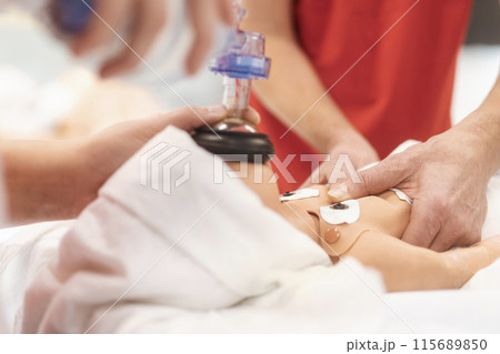 Training resuscitation training on newborn dummy. Training resuscitation training on newborn dummy. 115689850