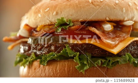 Delicious cheeseburger with cheese, lettuce, tomato, red onion and bun. Delicious cheeseburger with cheese, lettuce, tomato, red onion and bun. 115689928