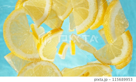 Freeze Motion of Lemon Slices Falling into Water, Splashing. Freeze Motion of Lemon Slices Falling into Water, Splashing. 115689953