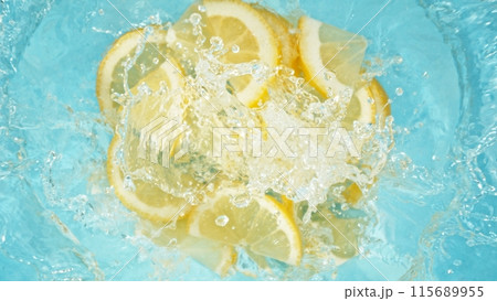 Freeze Motion of Lemon Slices Falling into Water, Splashing. 115689955