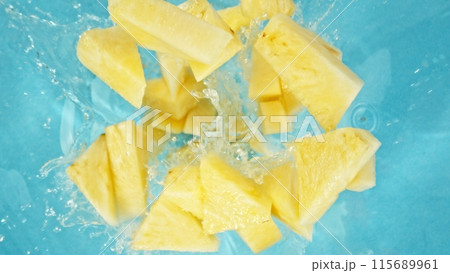 Freeze Motion of Pineapple Slices Falling into Water, Splashing. Freeze Motion of Pineapple Slices Falling into Water, Splashing. 115689961