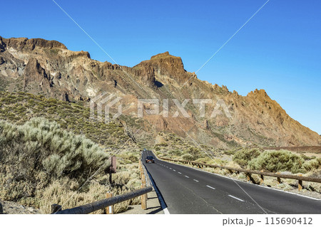 Asphalted road in the mountains, Sunny day Asphalted road in the mountains, Sunny day 115690412