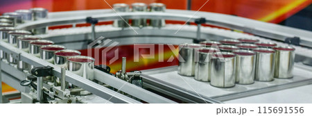 Canned food products on conveyor belt in distribution warehouse. parcels transportation system concept Canned food products on conveyor belt in distribution warehouse. parcels transportation system concept 115691556