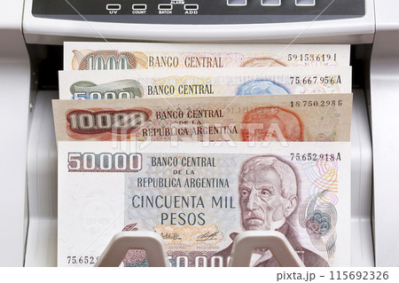 Old Argentine peso in the counting machine 115692326