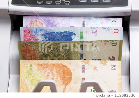 Argentine peso in the counting machine 115692330