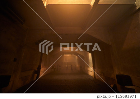 Dark concrete room with warm light 115693971