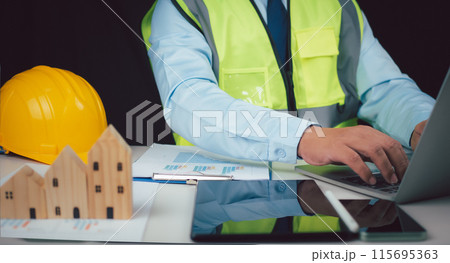 Construction planning, Structural calculation, Structural design, Project presentation plan, Construction cost planning, Architect or engineer using tablet to work on table, Cost calculation. 115695363