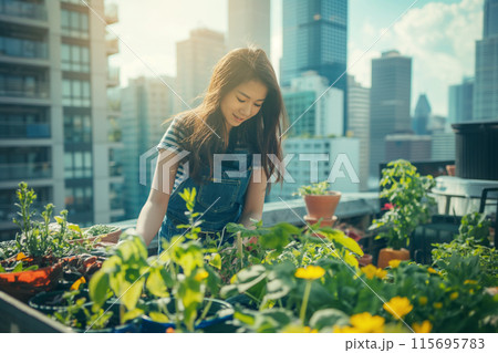 Woman gardening on rooftop with city skyline in the background 115695783
