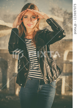 woman casual style posing against city fountain woman casual style posing against city fountain 115697073