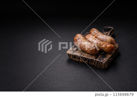 Baked chicken or pork sausages, salt, spices and herbs 115698679
