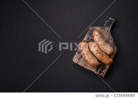 Baked chicken or pork sausages, salt, spices and herbs 115698680