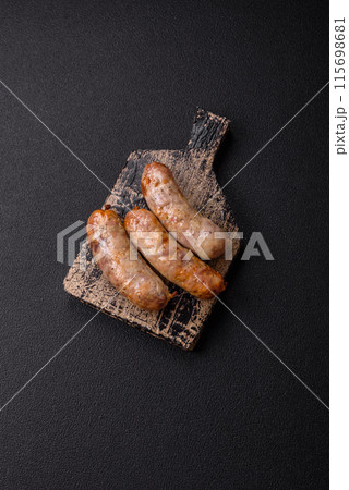 Baked chicken or pork sausages, salt, spices and herbs 115698681