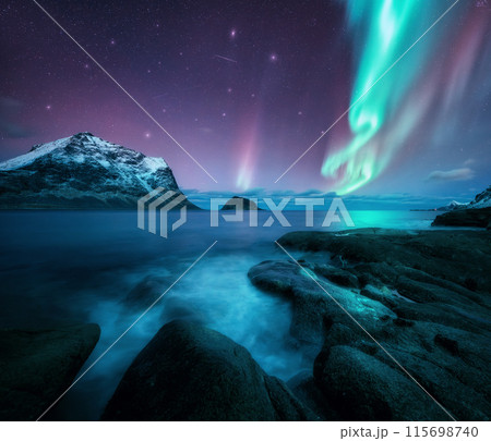 Aurora borealis over the sea, snowy mountains at starry night Aurora borealis over the sea, snowy mountains at starry night 115698740
