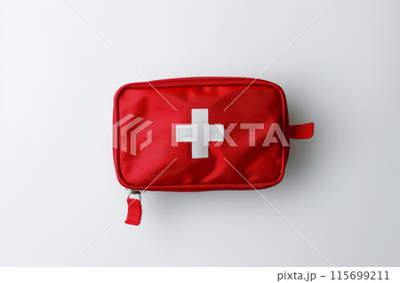 Compact first aid kit with a white cross symbol on a white background. Emergency preparedness 115699211