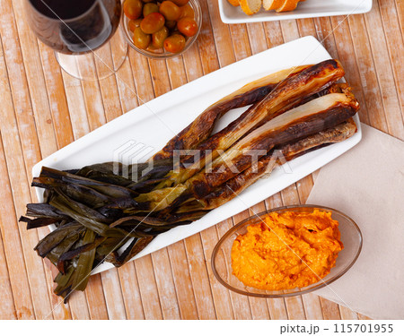 On rectangular plate - fried sweet green onions kalsot,supplemented jar of romesco sauce,red wine On rectangular plate - fried sweet green onions kalsot,supplemented jar of romesco sauce,red wine 115701955