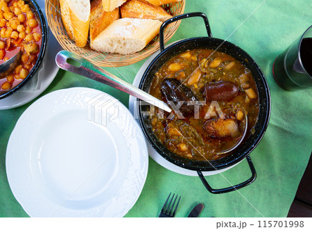 Pottage with sausage, potato and beans 115701998
