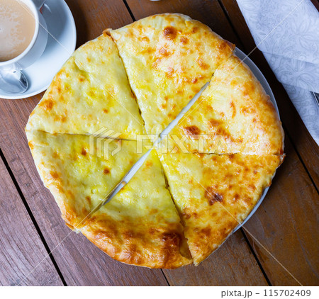 Delicious dish khachapuri Iveria with suluguni cheese Delicious dish khachapuri Iveria with suluguni cheese 115702409