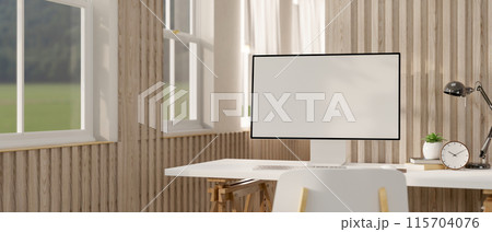 A computer desk in a contemporary minimalist home office features a computer against the wooden wall A computer desk in a contemporary minimalist home office features a computer against the wooden wall 115704076