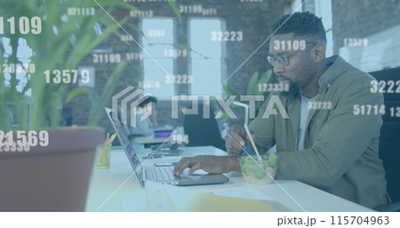 Image of data processing over african american businessman using laptop in office 115704963