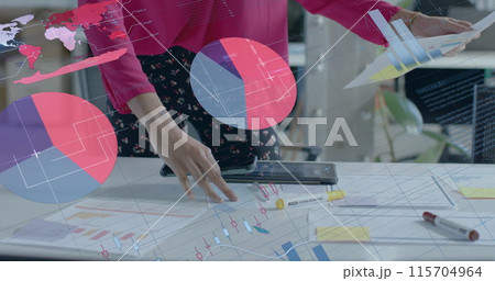 Image of data processing and diagrams over biracial businesswoman with blueprints in office Image of data processing and diagrams over biracial businesswoman with blueprints in office 115704964