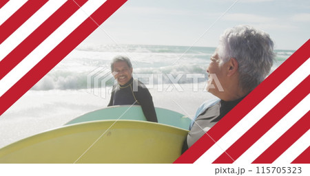 Image of flag of united states of america over senior biracial couple with surfboard on beach Image of flag of united states of america over senior biracial couple with surfboard on beach 115705323