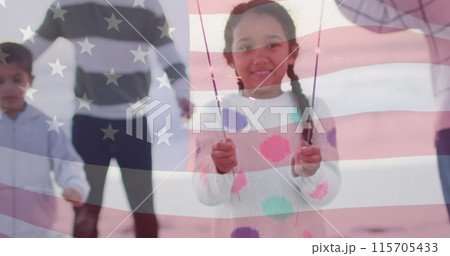Image of flag of united states of america over biracial girl holding sparklers Image of flag of united states of america over biracial girl holding sparklers 115705433