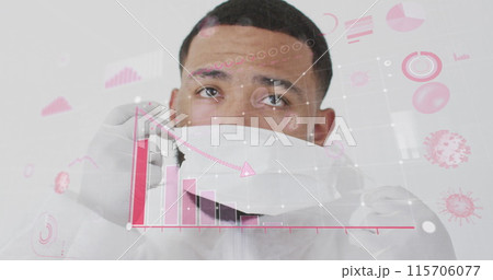 Image of coronavirus cells and diagrams over biracial male doctor wearing face mask Image of coronavirus cells and diagrams over biracial male doctor wearing face mask 115706077