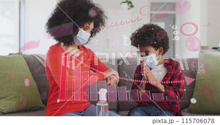 Image of diagram over biracial mother with son disinfecting hands with face masks 115706078