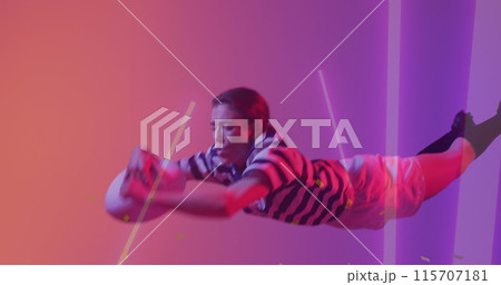 Image of neon lights over female rugby player on neon background Image of neon lights over female rugby player on neon background 115707181