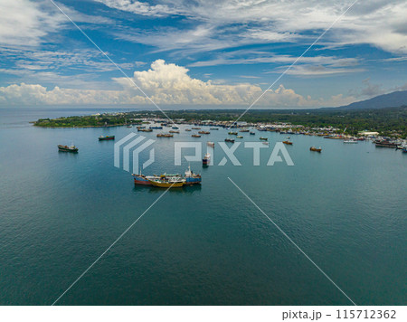 Fishing Boats floating over the sea in Zamboanga. Mindanao, Philippines. Seascape. Fishing Boats floating over the sea in Zamboanga. Mindanao, Philippines. Seascape. 115712362