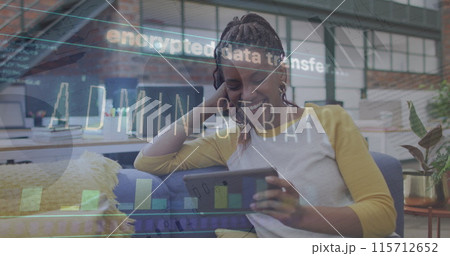Image of data processing over african american businesswoman using tablet Image of data processing over african american businesswoman using tablet 115712652