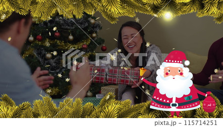 Image of santa claus and fir tree branches over happy asian woman receiving present 115714251