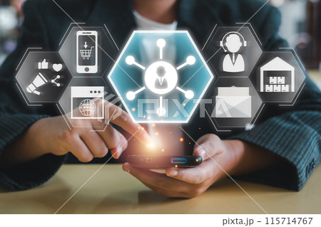 Businessman using smartphone with digital icons representing omni channel concept for seamless customer experience and integrated marketing strategy. Businessman using smartphone with digital icons representing omni channel concept for seamless customer experience and integrated marketing strategy. 115714767
