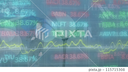 Businessman with umbrella views fluctuating stock market display. 115715308