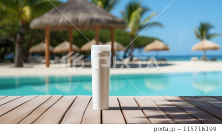 A tube of sunscreen sits on a beach bench 115716199