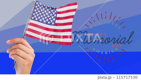Composition of hand holding american flag over happy memorial day text, on blue stripes 115717330