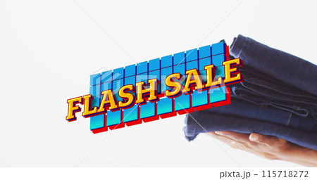 Image of flash sale text over hand holding denim trousers background 115718272