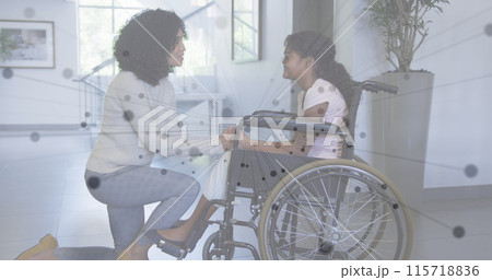 Image of network of connections over african american mother and daughter in wheelchair 115718836