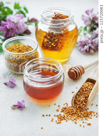 Raw organic bee pollen and honey in jars. Raw organic bee pollen and honey in jars. 115720063
