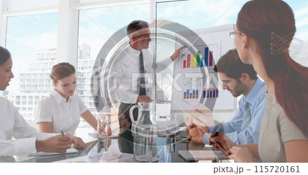 Image of clock over diverse business people at meeting 115720161