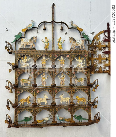 Metal stencils with decorative patterns on white walls. Metal stencils with decorative patterns on white walls. 115720682