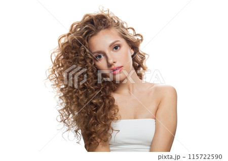 Isolated young woman with natural make-up, clear fresh skin and wavy hairstyle on white background 115722590