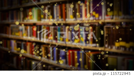 Image of glowing spots over books on shelf Image of glowing spots over books on shelf 115722945