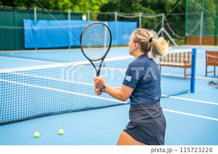 Professional female tennis player playing the tennis on outside court 115723228
